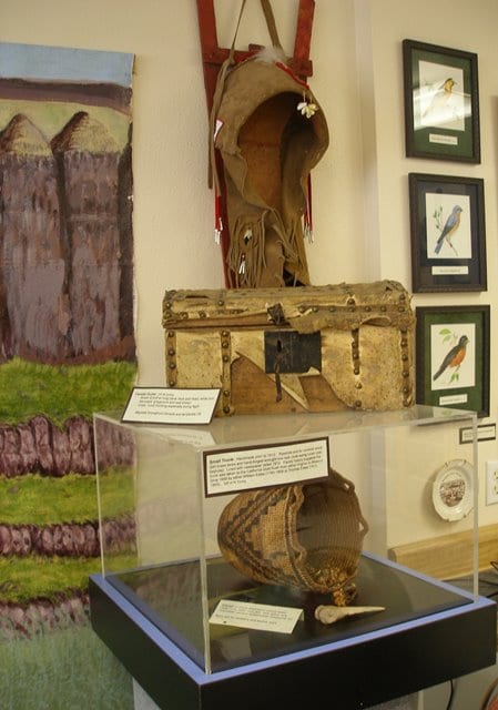 A hand woven basket, a baby carrier, and a trunk dating from 1812 are a link to the past at the Palus Museum.