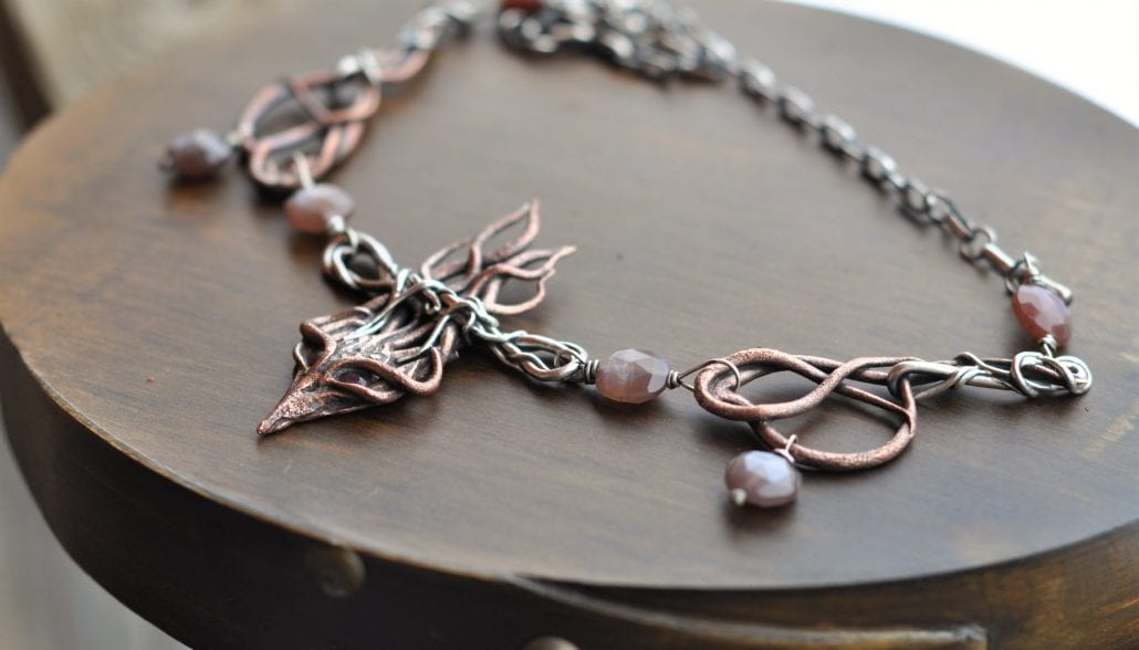Bronze, silver, ruby, and moonstone necklace by Rachelle Moore, guest artist at Wenaha Gallery