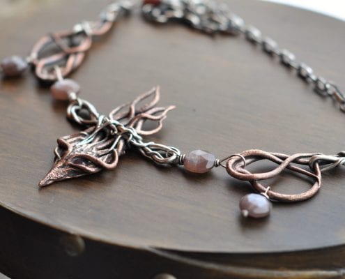 Bronze, silver, ruby, and moonstone necklace by Rachelle Moore, guest artist at Wenaha Gallery
